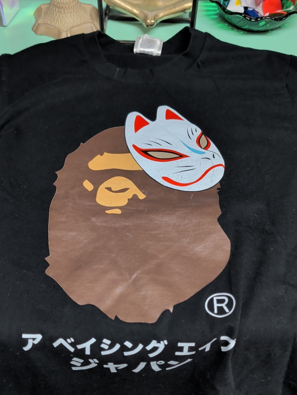 Black Graphic Tee with Brown Ape Silhouette & Light Blue Mask
